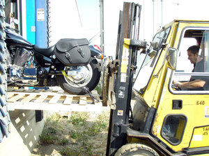 Leduc Truck Service owner Russ Klak offloads a beautiful new Harley