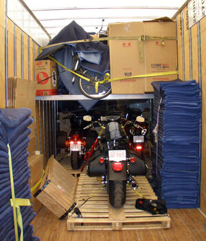 Motorsport bikes carefully protected during transport to their happy owners by Leduc truck Service